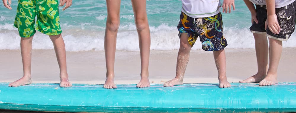 standing on surfboard